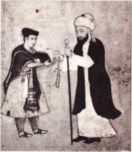 Şirazlı Hafız Divanından bir şiiri gösterirken